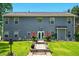 Rear exterior view of the home showcasing the landscaped backyard and patio area at 100 Chadwick Pl, Villa Rica, GA 30180