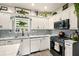 A kitchen featuring white cabinets, stainless steel appliances, granite countertops, and backsplash at 100 Chadwick Pl, Villa Rica, GA 30180