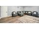 An open living room with a grey sofa and an area rug at 100 Chadwick Pl, Villa Rica, GA 30180