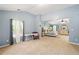 Spacious main bedroom featuring neutral carpet, vaulted ceiling, and a seating area by a bright window at 100 Chadwick Pl, Villa Rica, GA 30180