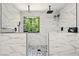 Large luxurious shower featuring dual rainfall showerheads and a decorative window at 100 Chadwick Pl, Villa Rica, GA 30180
