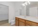 Bright bathroom featuring wood vanity and tile flooring at 3040 Peachtree Nw Rd # 1803, Atlanta, GA 30305