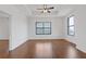 Spacious bedroom with hardwood floors, tray ceilings and city views from two large windows at 3040 Peachtree Nw Rd # 1803, Atlanta, GA 30305