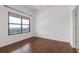 Bright bedroom with hardwood floors, large window, and ample natural light at 3040 Peachtree Nw Rd # 1803, Atlanta, GA 30305