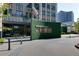Inviting building entrance with modern design and lush landscaping at 3040 Peachtree Nw Rd # 1803, Atlanta, GA 30305