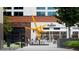 Outdoor view of the Rosetta bakery building featuring outside seating and art at 3040 Peachtree Nw Rd # 1803, Atlanta, GA 30305