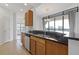Modern kitchen with stainless steel appliances, granite countertops, and ample cabinet space at 3040 Peachtree Nw Rd # 1803, Atlanta, GA 30305