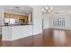 Open concept living room and kitchen with hardwood floors and large windows at 3040 Peachtree Nw Rd # 1803, Atlanta, GA 30305