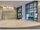 Grand lobby featuring stone walls, tiled floors, and ample natural light at 3040 Peachtree Nw Rd # 1803, Atlanta, GA 30305