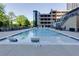 Resort-style pool with lounge chairs and tranquil setting for ultimate relaxation at 3040 Peachtree Nw Rd # 1803, Atlanta, GA 30305