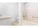 Accessible bathroom with shower/tub combo and handrails, alongside a single vanity and toilet at 320 Edna Dr, Stockbridge, GA 30281