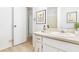 Bright bathroom features white vanity, mirror, and shower/tub combo with neutral walls at 320 Edna Dr, Stockbridge, GA 30281