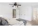 Cozy bedroom with a ceiling fan, a queen sized bed, and ample closet space at 320 Edna Dr, Stockbridge, GA 30281