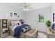 Charming bedroom featuring a built-in bed frame with bookshelves and an adjacent door to the outside at 320 Edna Dr, Stockbridge, GA 30281