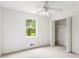 Sunlit bedroom offers ample closet space and a large window to enjoy views of the surrounding landscape at 320 Edna Dr, Stockbridge, GA 30281