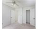 Clean and carpeted bedroom offers easy access to additional rooms and ample closet space at 320 Edna Dr, Stockbridge, GA 30281
