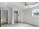 Bright bedroom with carpet, mirrored closet and a ceiling fan at 320 Edna Dr, Stockbridge, GA 30281
