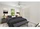 Modern bedroom with a queen sized bed, a soft rug, and beautiful nature artwork at 320 Edna Dr, Stockbridge, GA 30281