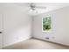 Bedroom has neutral carpet and a window to let in natural light at 320 Edna Dr, Stockbridge, GA 30281