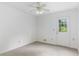 Bright bedroom features neutral carpet and a door that provides convenient outdoor access at 320 Edna Dr, Stockbridge, GA 30281