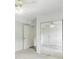 Spacious bedroom with carpet, mirrored closet doors, and ample natural light at 320 Edna Dr, Stockbridge, GA 30281