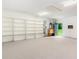 Large bonus room has carpet and built in shelves at 320 Edna Dr, Stockbridge, GA 30281