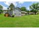 Charming exterior of a home with a covered porch, carport, and green lawn at 320 Edna Dr, Stockbridge, GA 30281