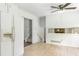 Open kitchen with tile floors and view to another room at 320 Edna Dr, Stockbridge, GA 30281