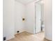 Laundry room with white walls, and a door that leads to the bathroom with toilet at 320 Edna Dr, Stockbridge, GA 30281
