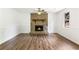 Inviting living room with stone fireplace, wooden mantle and stylish flooring at 320 Edna Dr, Stockbridge, GA 30281