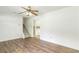 Inviting living room with hardwood floors, fan, and view of stairs at 320 Edna Dr, Stockbridge, GA 30281
