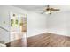 Spacious living room with hardwood floors and view of the kitchen at 320 Edna Dr, Stockbridge, GA 30281