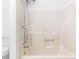 Well-lit shower features neutral walls and handrails for accessibility at 320 Edna Dr, Stockbridge, GA 30281