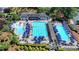 Aerial view of neighborhood pool with plenty of lounge chairs and umbrellas, great for relaxing on a summer day at 3467 Clubland Dr, Marietta, GA 30068
