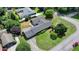 Aerial view of ranch-style home featuring a sprawling roof, lush landscaping, and a long driveway at 3467 Clubland Dr, Marietta, GA 30068