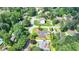 Aerial view of charming home, nestled on a lush lot with mature trees and a well-manicured lawn at 3467 Clubland Dr, Marietta, GA 30068