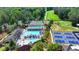 Aerial view of neighborhood pool and tennis courts, perfect for enjoying a hot summer day at 3467 Clubland Dr, Marietta, GA 30068