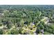 Aerial view of charming home, nestled on a lush lot with mature trees in a desirable community at 3467 Clubland Dr, Marietta, GA 30068