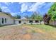 This backyard features a patio, lush lawn, and mature trees at 3467 Clubland Dr, Marietta, GA 30068