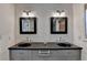 Bathroom featuring double sinks, framed mirrors, and a sleek vanity at 3467 Clubland Dr, Marietta, GA 30068