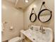 Stylish bathroom with a unique double-faucet sink and round decorative mirrors at 3467 Clubland Dr, Marietta, GA 30068