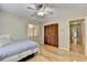 Comfortable bedroom with hardwood floors, a twin bed, and a closet with wooden louvered doors at 3467 Clubland Dr, Marietta, GA 30068