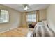 Bedroom featuring light hardwood floors, a twin bed, and a large window for natural light at 3467 Clubland Dr, Marietta, GA 30068