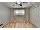 Bright bedroom featuring hardwood floors, ceiling fan, and ample natural light at 3467 Clubland Dr, Marietta, GA 30068