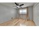 Bright bedroom featuring hardwood floors, ceiling fan, and ample natural light at 3467 Clubland Dr, Marietta, GA 30068