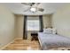 Inviting bedroom with hardwood floors, a twin bed, and a window providing natural light at 3467 Clubland Dr, Marietta, GA 30068