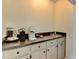 Efficient butler's pantry with sleek countertop, modern appliances, ample cabinet storage, and contemporary design at 3467 Clubland Dr, Marietta, GA 30068