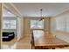 Open dining room with hardwood floors, a large window, and a view into the living space at 3467 Clubland Dr, Marietta, GA 30068