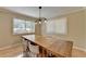Cozy dining room with natural light, modern light fixture and hardwood floors at 3467 Clubland Dr, Marietta, GA 30068