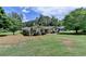 Sprawling single-story home with mature trees in a serene, green setting at 3467 Clubland Dr, Marietta, GA 30068